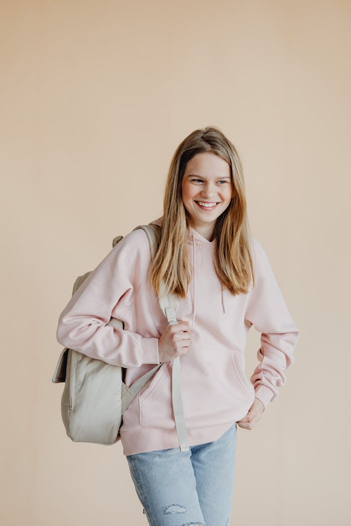 A Girl wearing Hoodie Carrying Backpack